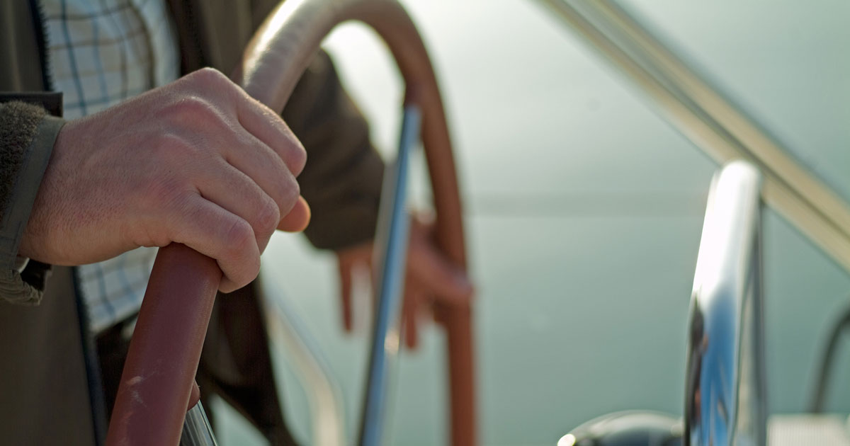 Man Holding Boat Steering Wheel